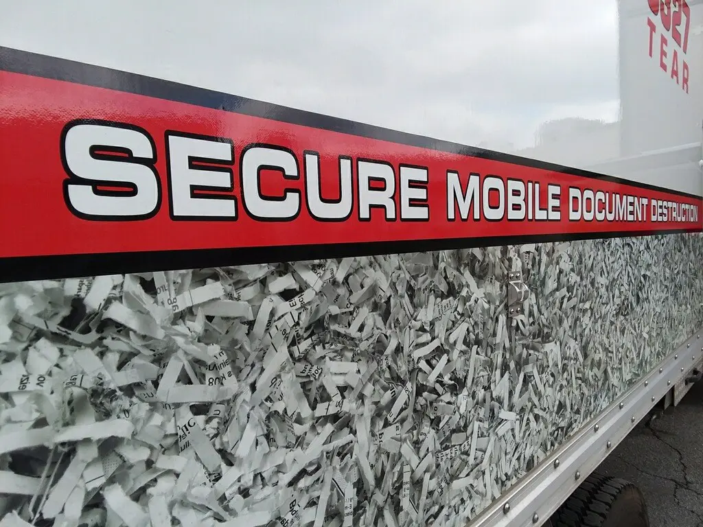 A close up of the side of the shredding truck with the words Secure Mobile Document Destruction featured.
