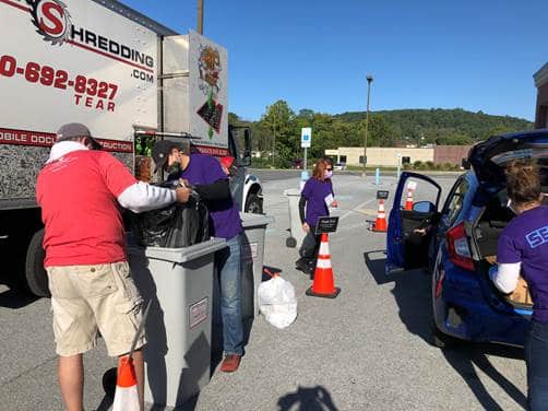 People Dropping Off Materials to be shred at a local shred event