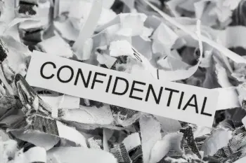 shredded paper with the word confidential shown on one piece