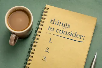 things to consider list - handwriting in a notebook with a cup of coffee