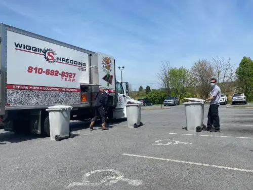 The Shred Truck with Multiple Secure Collection Containers waiting to be shredded