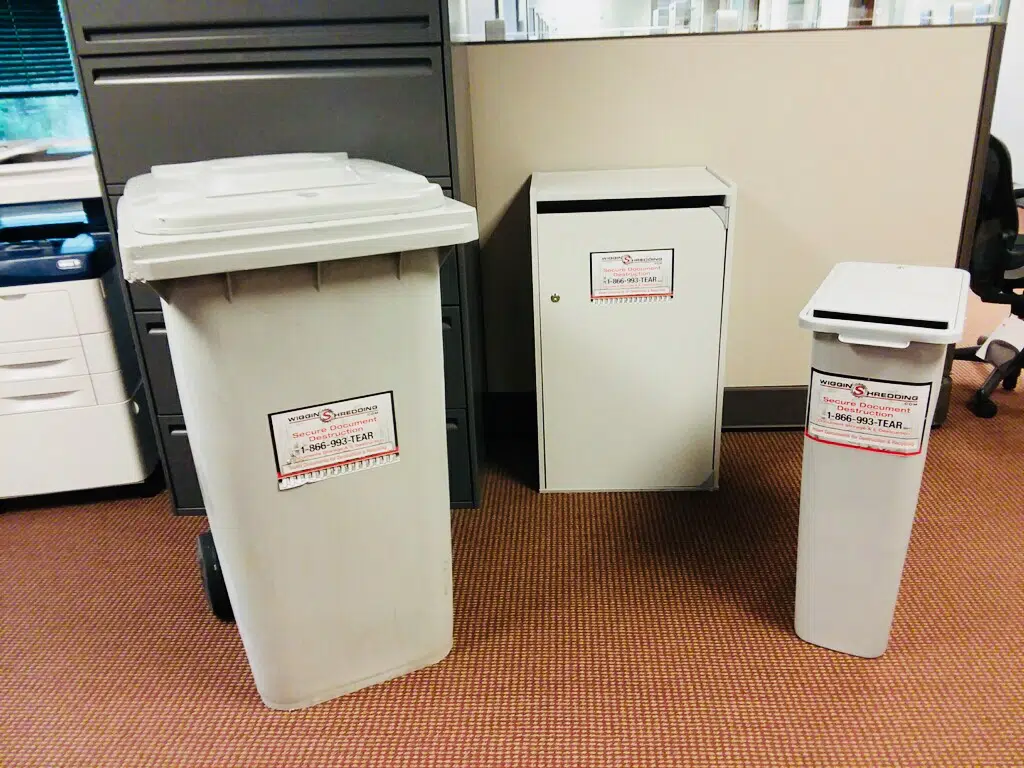 A photo showing three different sizes and styles of secure collection containers that Wiggins offers