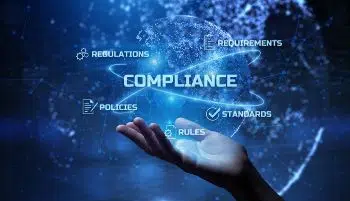 A hand cupped underneath floating words on a blue galaxy-style background. Words are: Compliance, Regulations, Requirements, Standards, Rules, Policies.