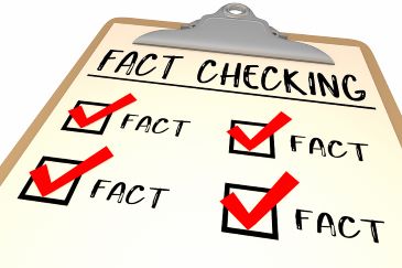 A paper on a clipboard has the words "Fact Checking" appearing above four checked boxes.